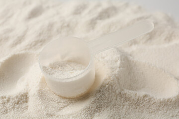 Collagen powder and scoop as background, closeup
