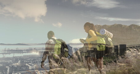 Composite of diverse couple hiking on mountain, and modern cityscape
