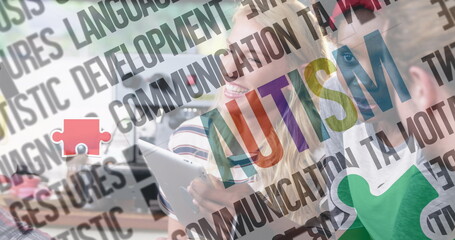 Image of colourful puzzle pieces and autism text over business people using digital devices