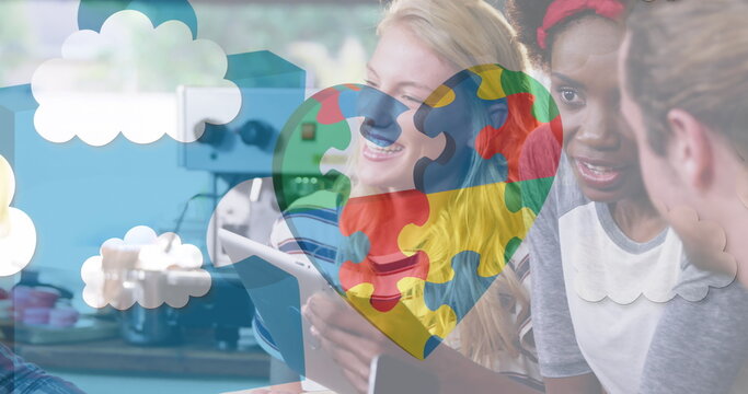 Image of colourful puzzle pieces over business people using digital devices - Powered by Adobe