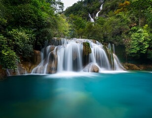 Beautiful waterfall, long exposure of many layers of waterfall to the river with clear blue color water