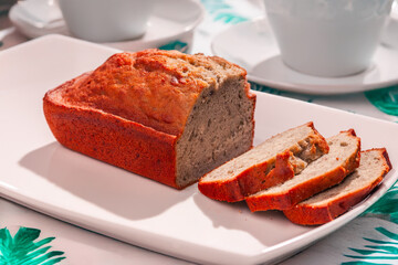 Banana cake on a white plate, ready to share.