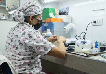 Close-up of a dental technician’s hands made a dental model with precision, showcasing artistry and professional expertise