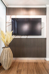 Calm waiting room interior with modern furniture. Features sofa, armchairs, wood accents, textured walls, and stylish decor. Ideal for relaxation or reception