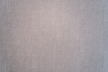 Detailed view of gray textile surface with a crosshatched woven pattern, ideal for backgrounds or material design references