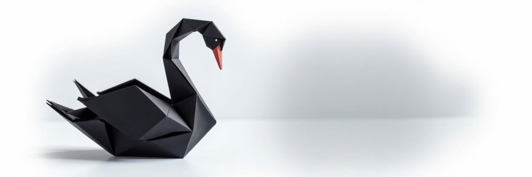 Intricately folded black swan made of origami paper on a white background, hobby, art, creative