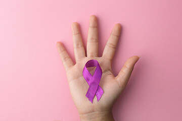 Purple Color Ribbon On Palm Hand Isolated On Pink Background Support For Pancreatic Cancer. World Cancer Day.