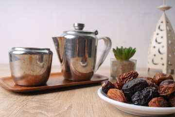 Dates Fruit And Tea Set On Wooden Table. Preparation For Breakfasting On Iftar Time At Ramadan Month.