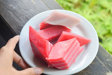 A delicious cake with a blush color, a cake with many sweet layers