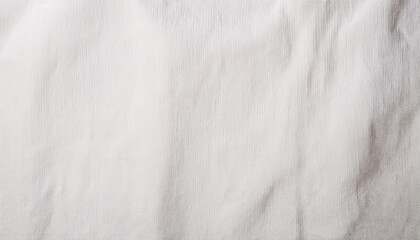 Abstract grayscale texture with variations in tone and density, creating a mottled effect. The image features a blend of light and dark shades of gray, showing a rough and uneven surface, suggesting