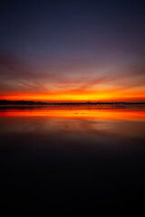 Twilight low angle beach scene with vibrant colors and copy space