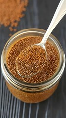 Brown Sugar Crystals in Glass Jar Spoon Close Up
