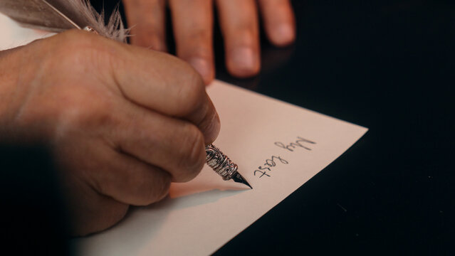 Old Caucasian man writing last will male pensioner elderly document testament estate law aged inheritance property preparing death wish notary office home business grandfather finance signing trust