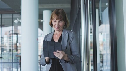 senior business woman work using tablet in the office 