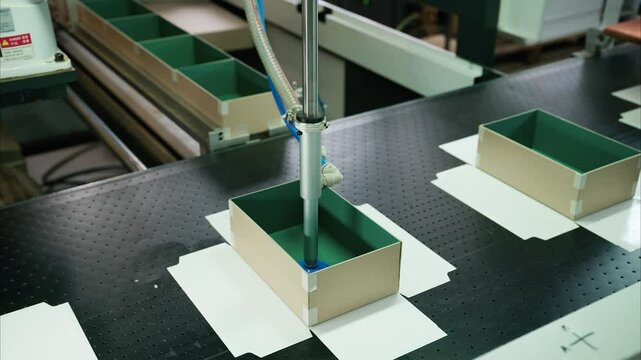 Innovative robot-driven cardboard box gluing process in a state-of-the-art manufacturing plant