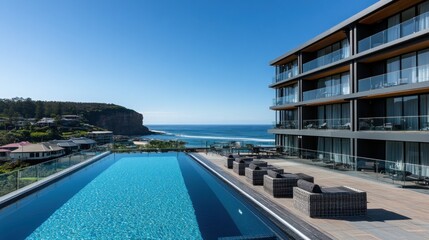 Fototapeta premium Infinity Pool Overlooking the Ocean and Cliffs