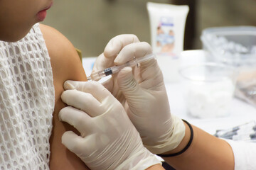 Patient asian woman health check by get vaccinated