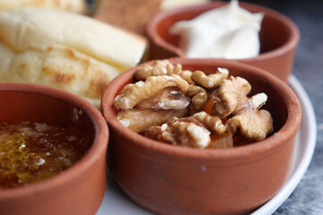 Enjoying a delicious traditional breakfast with honey and walnuts