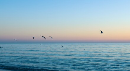 Fototapeta premium Blue Picture. Serenity at dawn with birds flying over calm ocean waters under a pastel sky near a quiet beach Generative AI