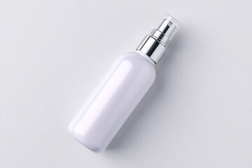 pristine white cleaning bottle with spray nozzle is placed at angle on seamless white background creating minimalist