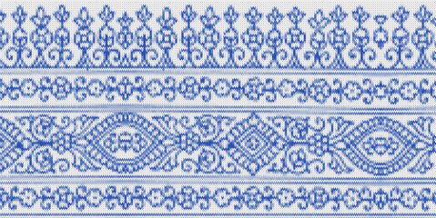 Traditional ornamental floral border pattern in blue with intricate symmetrical details.