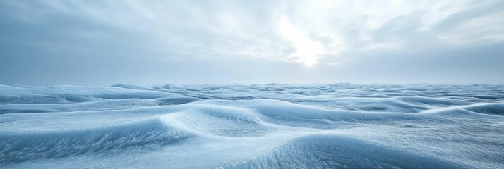 Obraz premium Serene expanse of snow drifts and ethereal sunlight beneath a tranquil blue sky