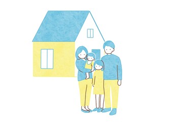 新しい一軒家をバックに立つ家族