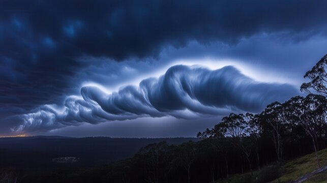 Dramatic storm clouds rolling over landscape