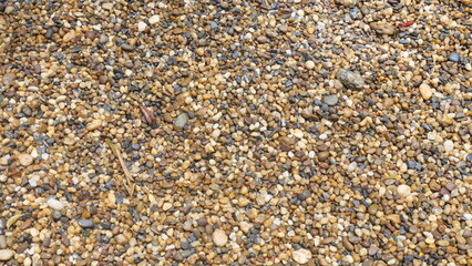 Round gravel ground in brown and black tones