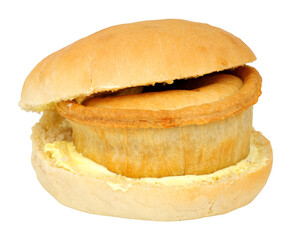 Wigan kebab meat and potato pie sandwich a savoury pie in a buttered bread roll popular chip shop food item from Wigan Greater Manchester England isolated on a white background