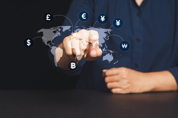 Business hand interacting with global digital map showing major world currency icons and exchange.