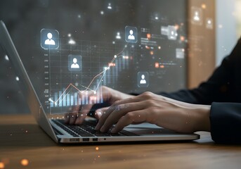 Marketer analyzing data with using laptop computer at desk in office. Statistical marketing analytics for effectiveness measurement and prediction. Regression analysis of customer behavior data. 