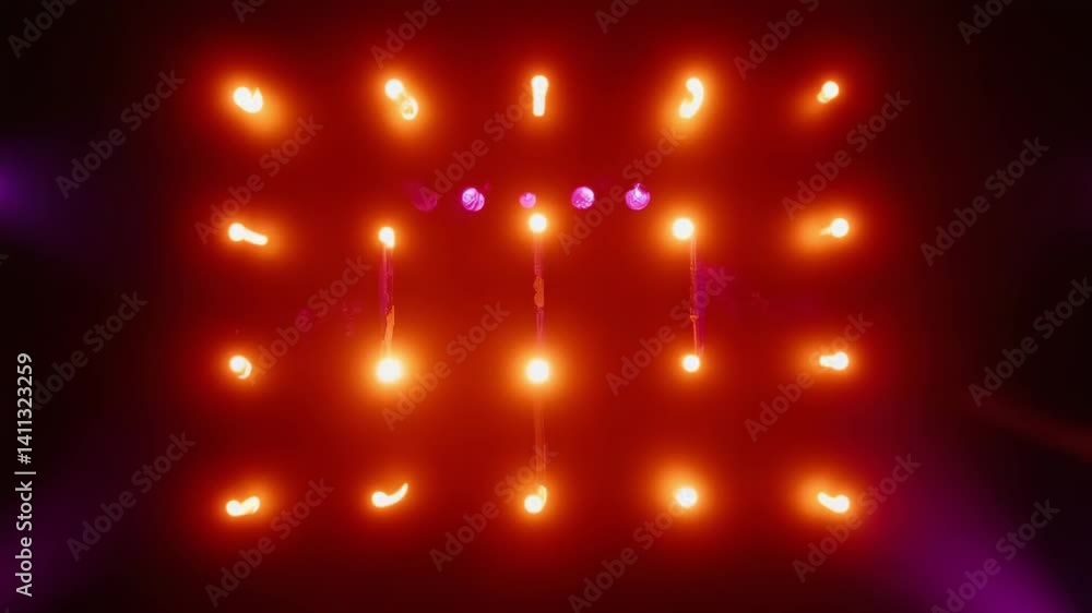 Poster bright orange lights create a stunning visual display in a darkened space, capturing the essence of 