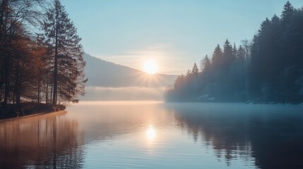 Fototapeta premium Misty Sunrise over a Calm Lake
