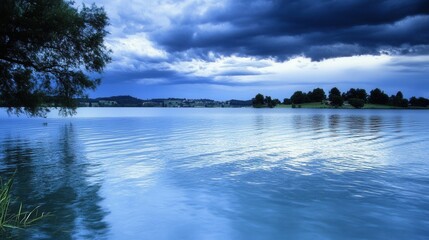 Fototapeta premium Serene lake landscape at dusk with dramatic clouds