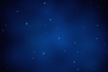 Fototapeta premium snow falling on a dark blue background