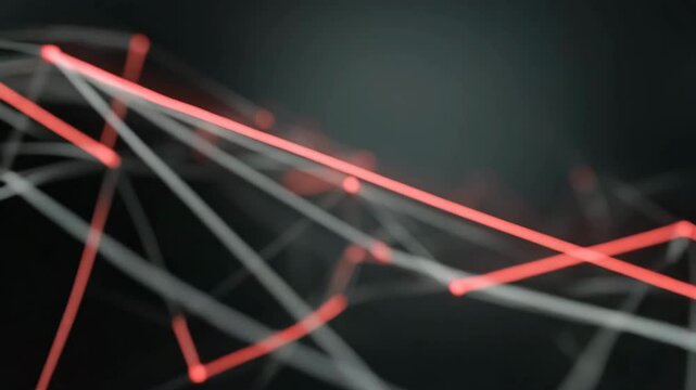 Interconnected red and white dots and lines form an abstract network against a blurred dark gray background, suggesting digital connections or data flow.