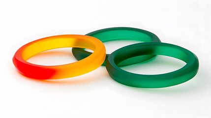 Three vibrant bangles in orange, yellow, and green hues.  Smooth, glossy finish. Perfect for summer fashion or jewelry design inspiration.