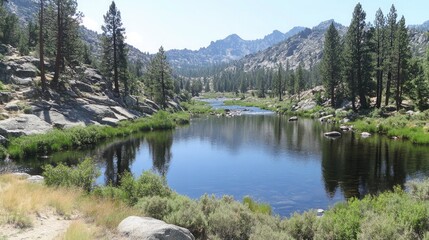 Fototapeta premium High-resolution image of a peaceful river valley reflecting granite mountains with trees along the riverbanks