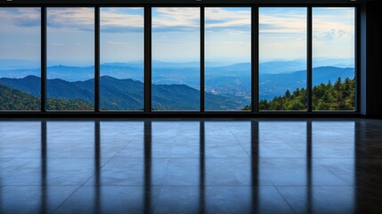 Fototapeta premium Empty room with large windows showcasing mountain view