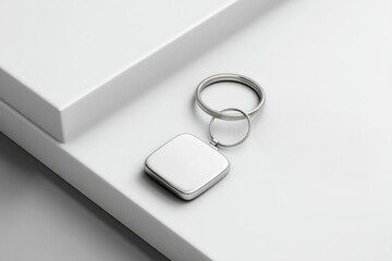 Modern, minimalist square metal keychain.