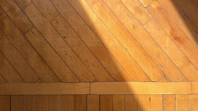 Old vintage parquet floor in old house with sun rays in slow motion top view