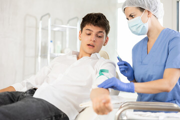 Fototapeta premium Anesthesiology procedure in the office of a doctor in a cosmetology clinic