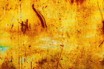 Yellow metal with rust and blue remnants