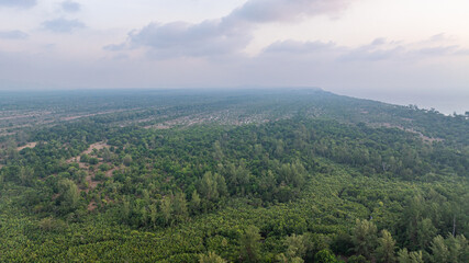 Naklejka premium Aerial view of above Koh Phra Thong Phang Nga Thailand. The lush green forest has white sand beaches around the island and there are small islands. The pristine nature is perfect for relaxation.