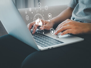Businessman uses cloud computing technology via laptop to connect to backup and store data in online cloud system on internet network in future.