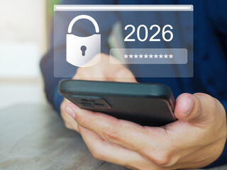 Cyber ​​​​Security and Data Protection In 2026, businessmen use smartphones to encrypt...