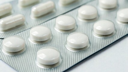 White Blister Pack of Pills with Natural Lighting on Clean Studio Background