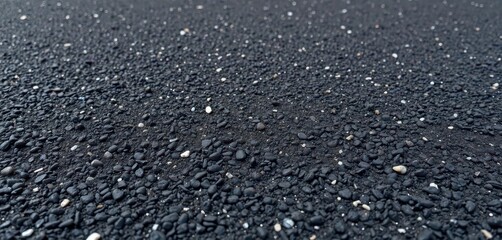Coarse asphalt texture, dark grey with aggregate visible, abstract, distressed
