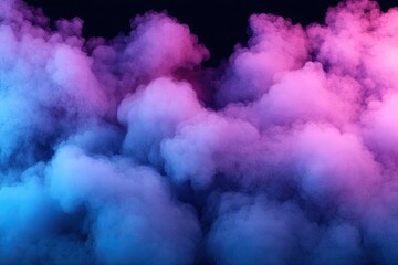 Obraz premium Vibrant pink and blue smoke clouds on black background